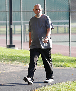 Man walking outdoors.