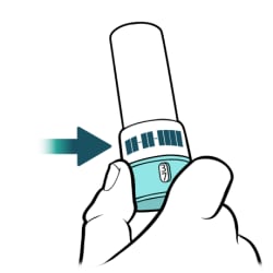 Hand holding bottom of inhaler, with expiration date on cap of inhaler.