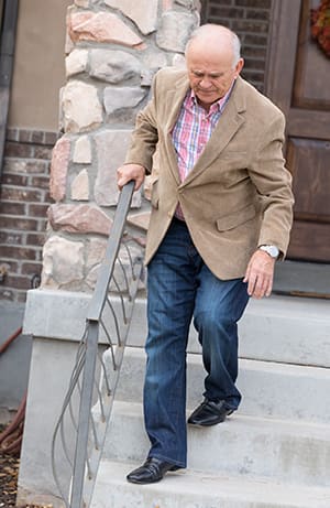 Person losing balance while going down stairs.