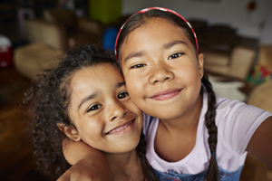 Two girls smiling.