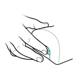 Finger pushing power switch on side of nebulizer machine.