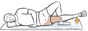 Man lying on side doing hip adduction exercises..