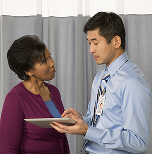 Woman talking to healthcare provider.