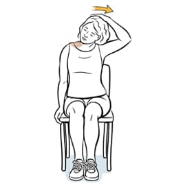 Person sitting in chair doing tension release neck exercise.