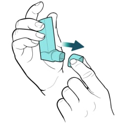 Hand holding inhaler upright, with other hand removing cap from mouthpiece.