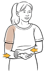 Woman doing internal rotation shoulder exercise.